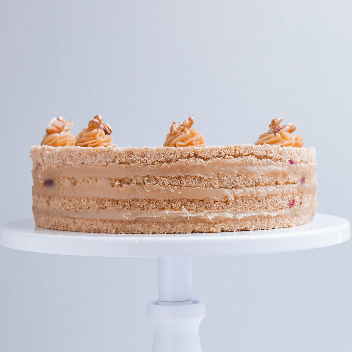 Torta Crocante Nuez y Caluga con Frambuesa